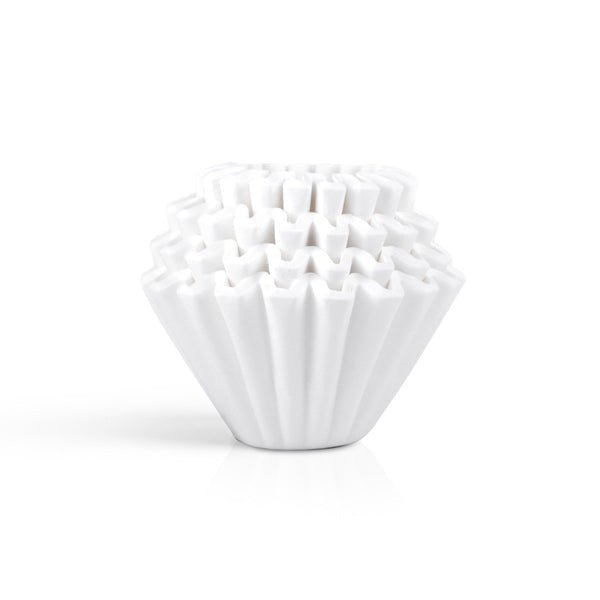A stack of Kalita 185 Paper Filters by Kalita, featuring white, fluted paper filters arranged neatly against a plain white background.