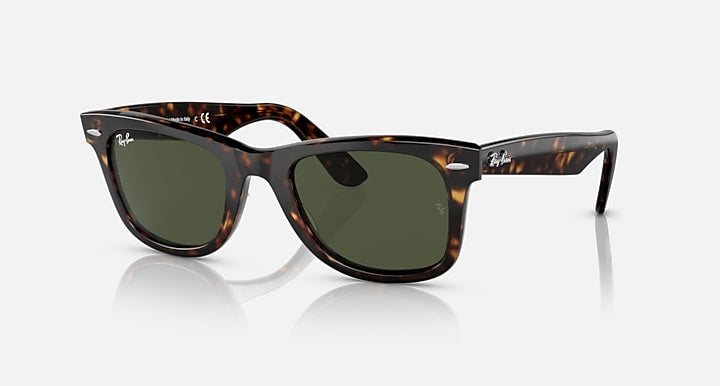 Ray-Ban 2140 Wayfarer sunglasses with tortoiseshell frames and green tinted lenses displayed on a white background.