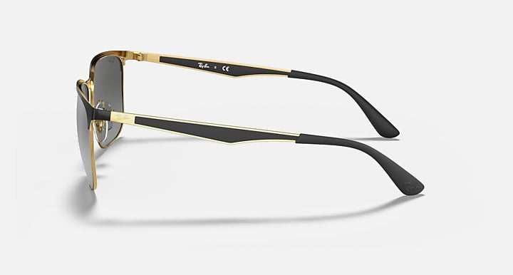 Side view of Ray-Ban 3569 square metal sunglasses featuring gold and black frames, mirror lenses, and black plastic temple tips—ideal for pairing with fashion-first activewear.