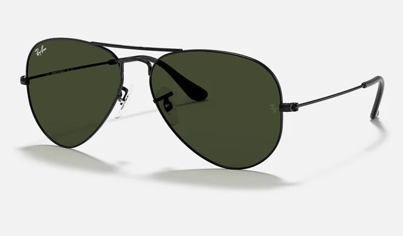 The Ray-Ban Aviator Classic sunglasses, featuring black frames and green lenses, are shown on a plain background, highlighting the iconic style of this Ray-Ban design.