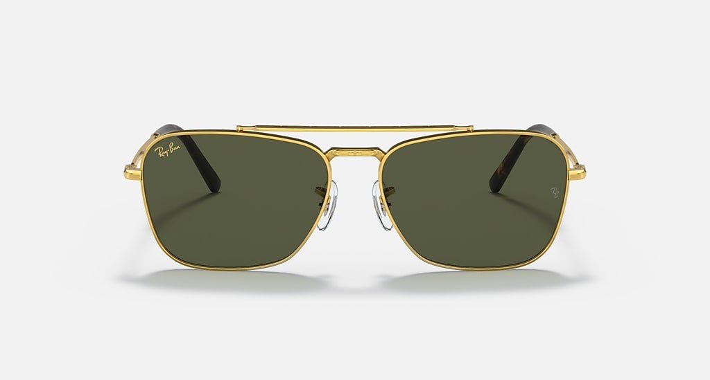 Front view of Ray-Ban Caravan | Arista w/ Green sunglasses featuring gold metal frames, green lenses, and a double bridge, shown on a plain light background.