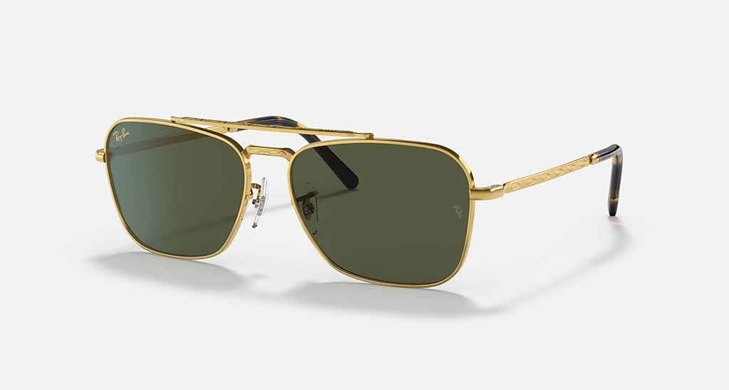 Ray-Ban Caravan | Arista w/ Green sunglasses feature gold aviator frames, green lenses, thin arms, signature engravings, and a double bridge, shown against a simple light background.