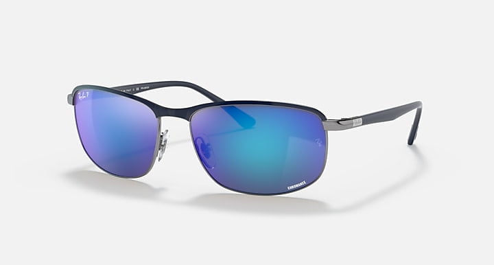 Ray-Ban Chromance sunglasses with thin gunmetal frames and Polar Grey Mirror Blue lenses for clear vision, shown on a white background.
