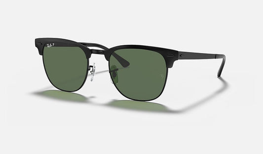 A pair of Ray-Ban Clubmaster Metal sunglasses in Matte Black on Black with polarized green lenses and metal frames, featuring adjustable nose pads, displayed on a plain light background.