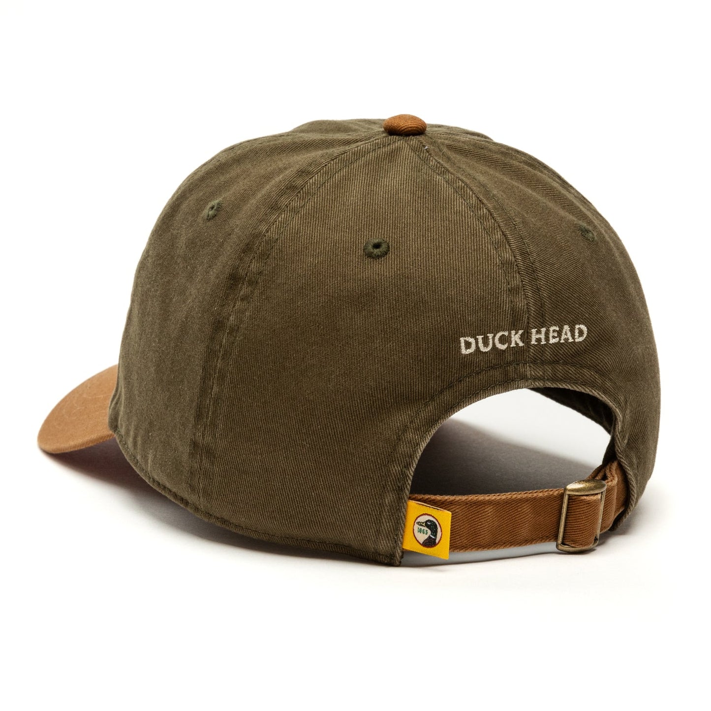 A Duck Head Dark Olive Circle Patch Twill Hat with a brown strap.