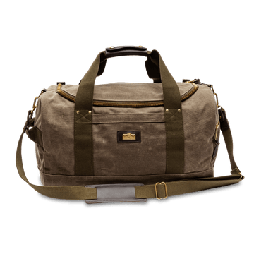 The Duck Head Duffle Bag features brown waxed canvas, olive green straps, a shoulder strap, and a front logo patch—a durable travel companion for every adventure.
