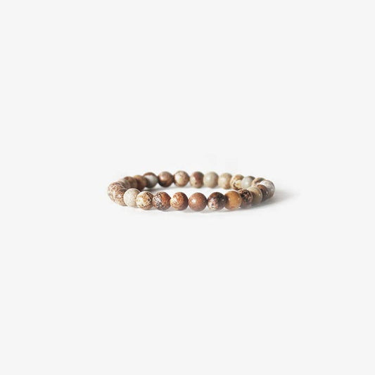 The BRANCO Earth Bracelet features round, brown and beige marbled picture jasper stones, showcased on a plain white background.
