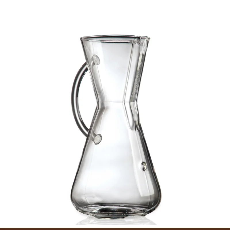 The Chemex Filter Drip Coffeemaker (CM-1GH) by Chemex features clear borosilicate glass with a wide base, narrow neck, curved handle, and spout, photographed against a white background.