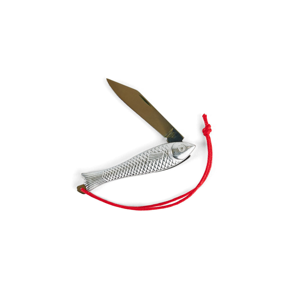 The Mollyjogger Fingerling Fish Knife is a folding pocket knife with a fish-shaped handle, red string loop, and open stainless blade—an eye-catching piece of cutlery.