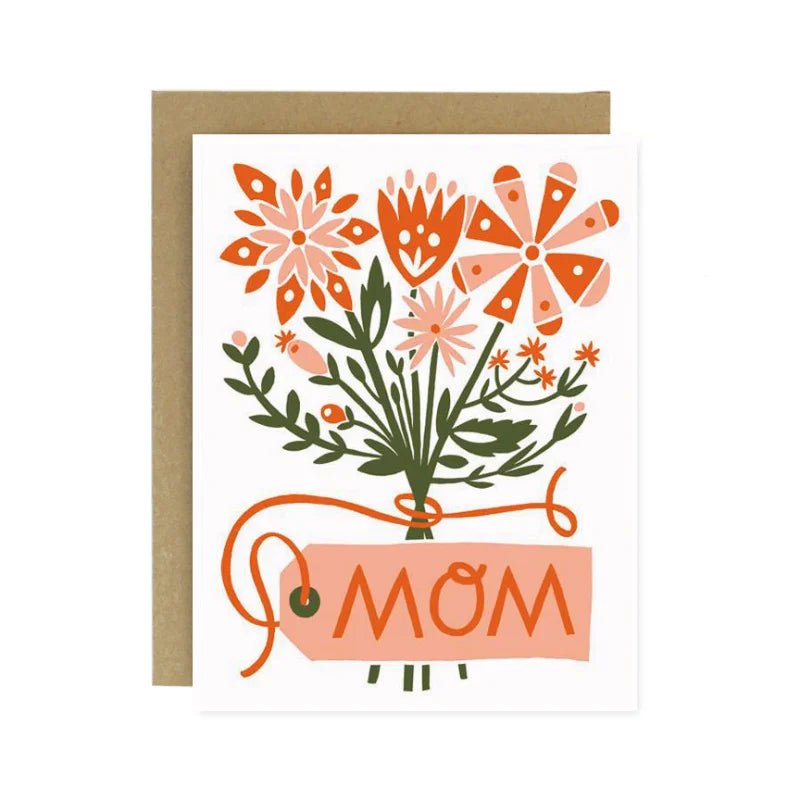 The Flower Bouquet Mother's Day Card by Worthwhile Paper features a screen printed orange and pink floral design with a "MOM" tag on recycled cardstock, paired with a brown envelope—eco-friendly and perfect for mom.