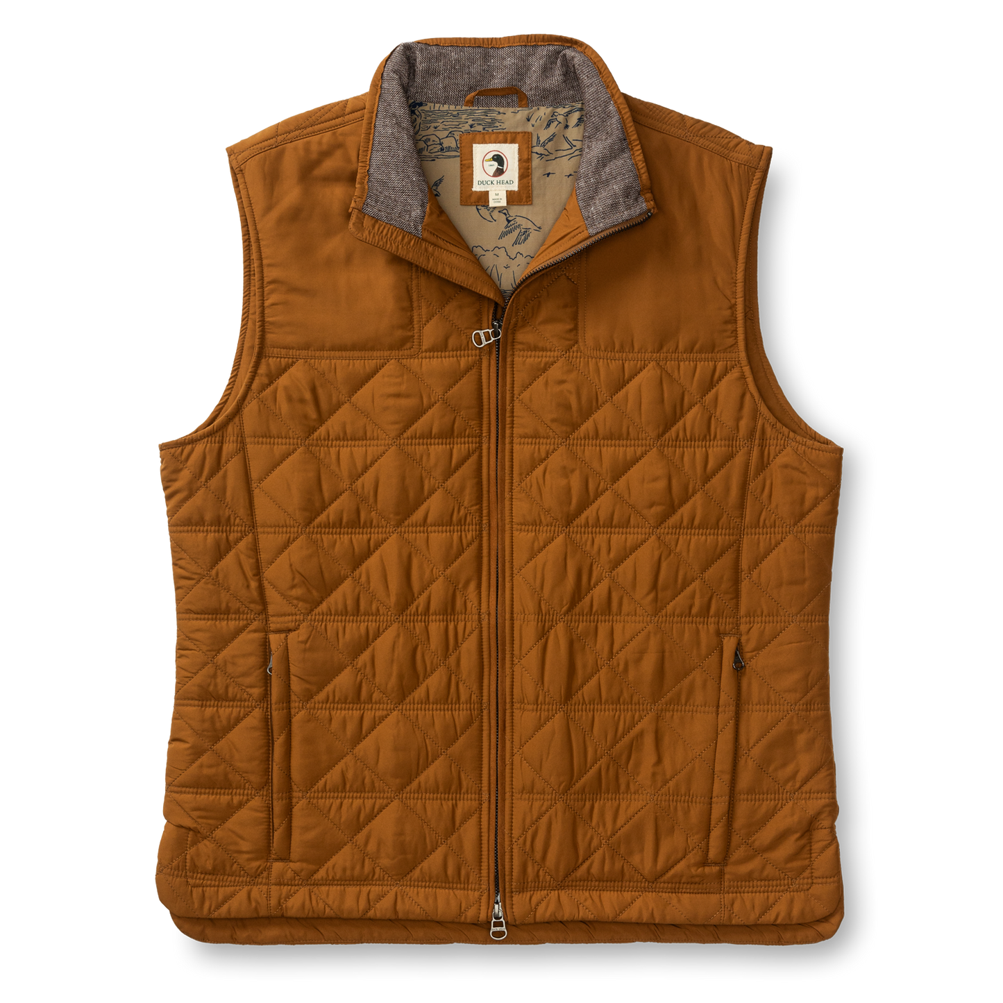 The Duck Head Fremont Sport Performance Quilted Vest features PrimaLoft Black Insulation, a front zipper, two side pockets, and a patterned inner lining—this lightweight brown vest is displayed on a white background.
