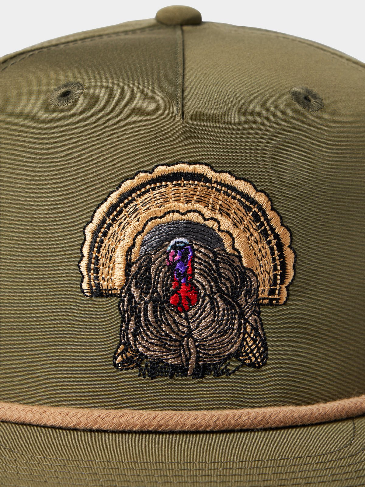 The Duck Camp Grandpa Hat in olive features an adjustable snapback and an embroidered turkey with brown, black, purple, and red details on the front.