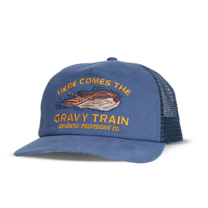 The Gravy Train Hat by Sendero Provisions Co. features blue mesh, an embroidered "Here Comes the Gravy Train" and flying fish graphic, plus the brand logo—ideal for anglers or fans of fishing and adventure.
