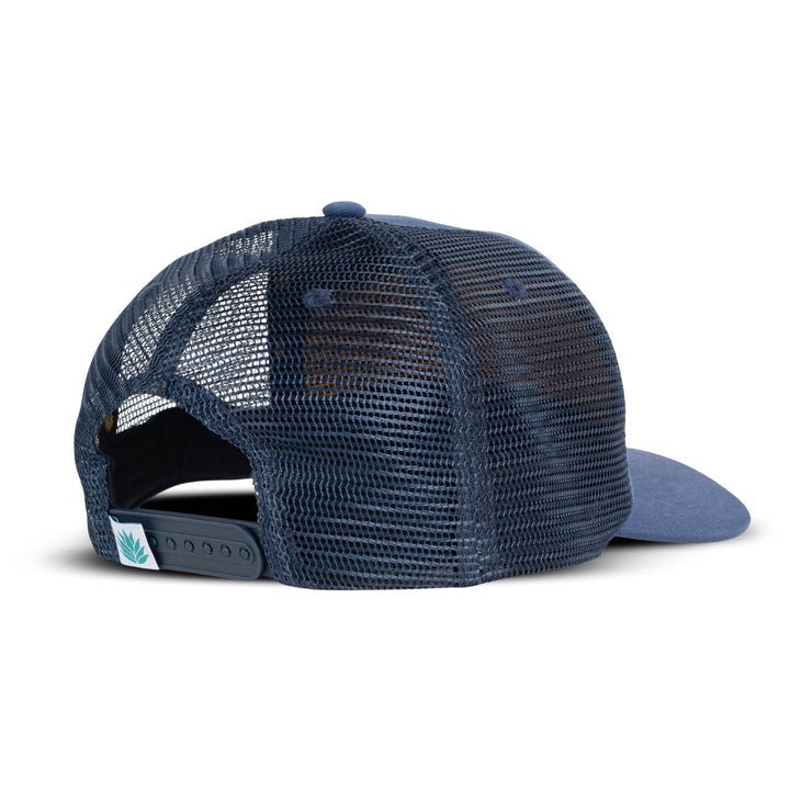 The Gravy Train Hat by Sendero Provisions Co. is a blue mesh trucker hat shown from the back, featuring an adjustable snap closure and a small tag with a green leaf design—perfect for aspiring streamers.
