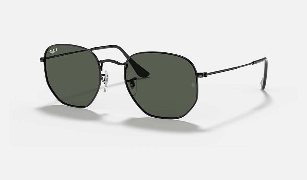 Ray-Ban Hexagonal Flat Arista sunglasses feature green polarized rectangular lenses and black metal frames, shown against a plain light background.
