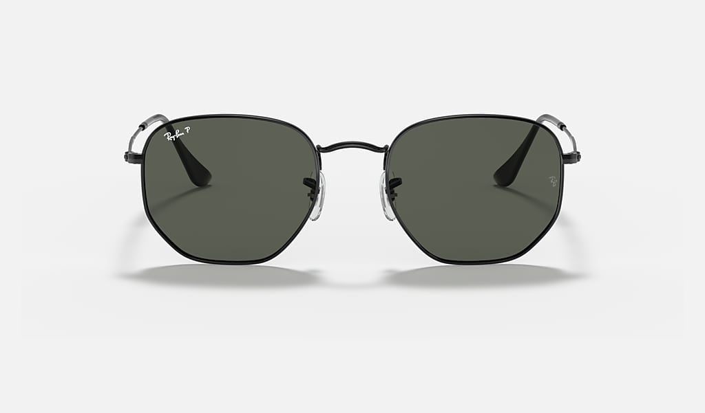 Front view of Ray-Ban Hexagonal Flat Arista sunglasses with green polarized lenses and thin frames, featuring the Ray-Ban logo on the left lens.