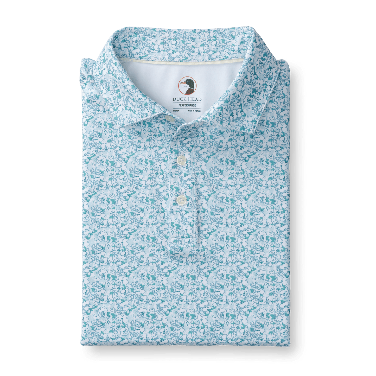 The Duck Head Long Drive Performance Polo features a light blue and white floral pattern, quick-dry, moisture-wicking fabric, and an inside collar Duck Head logo.