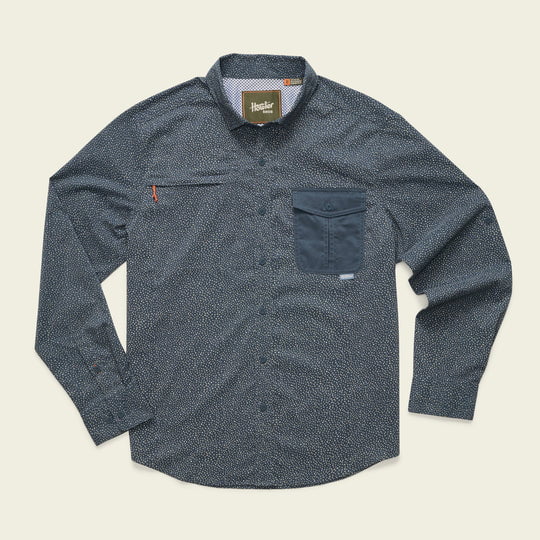 The Howler Brothers Matagorda Long Sleeve | Lotsa Dots shirt features a small dotted pattern, contrasting dark chest pocket with zipper, button-up design, and quick-dry fabric for all-day comfort.