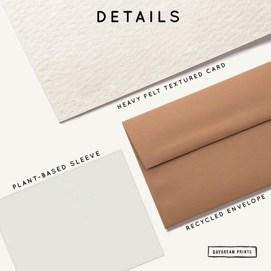 Flat lay of the Merry Merry card by Daydream Prints, made from heavy felt textured card, paired with a recycled brown envelope and a clear plant-based sleeve—each material is clearly labeled for sustainability.