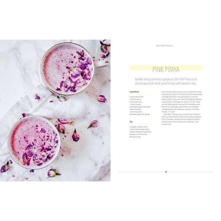Two Union Square and Co. Moon Milk drinks in clear glasses, topped with dried rose petals and served on a white marble surface with scattered rosebuds; recipe appears on the right page.