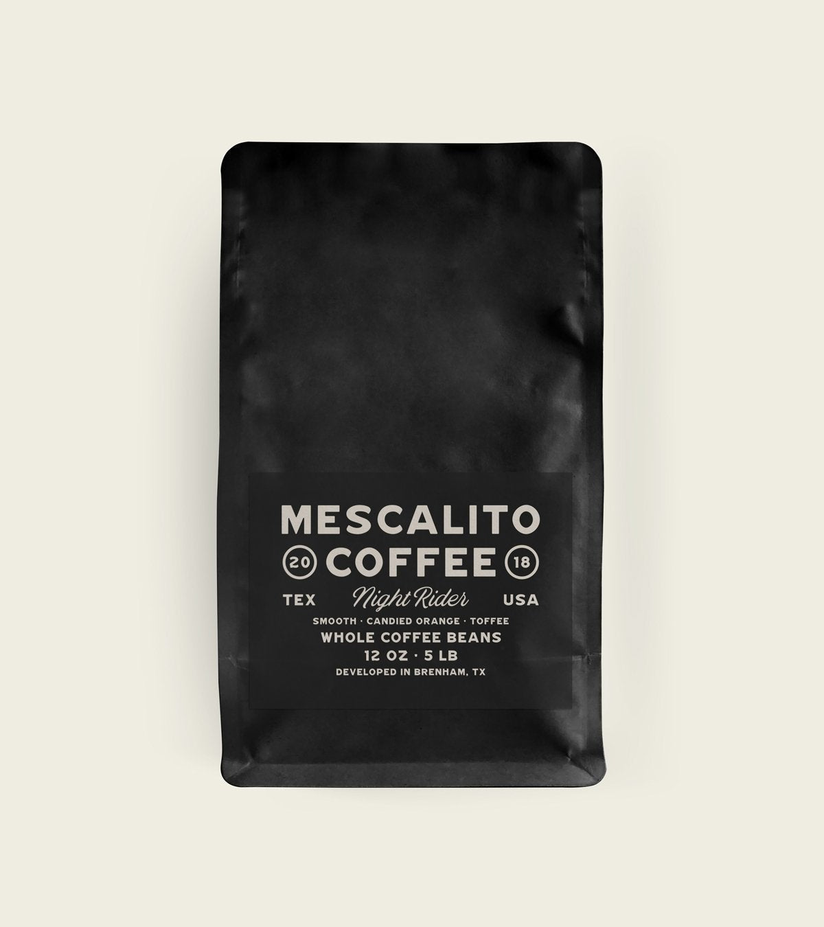 Mescalito Coffee’s Night Rider is a black bag of whole medium roast beans (12 oz–5 lb), crafted in Brenham, TX, with smooth candied orange and caramel milk chocolate notes.