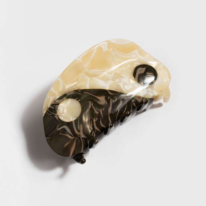 The Winona Irene Original Large Neutral Yin-Yang Hair Claw features a stylish acetate butterfly wing shape with a black and white yin-yang design on a neutral background.