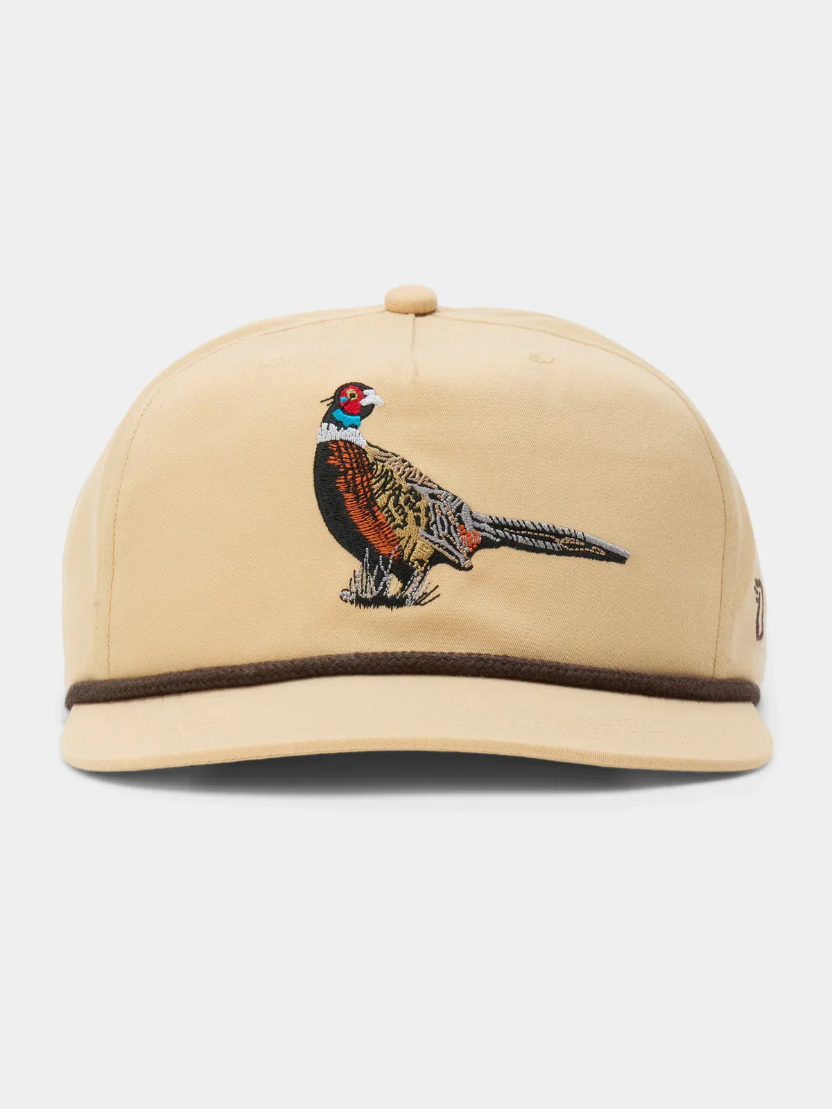 The Duck Camp Pheasant Hat features a tan design with brown trim, an embroidered pheasant on the front, and an adjustable snapback for a comfortable fit.