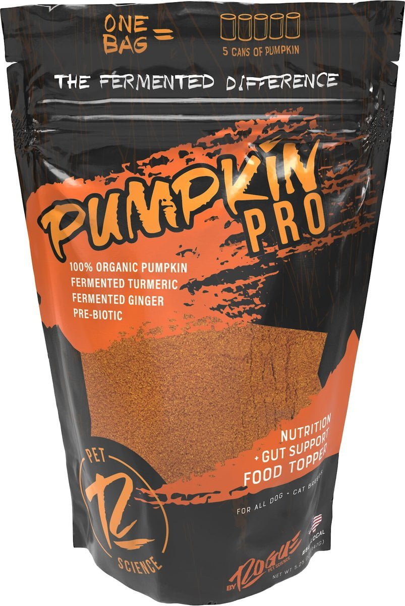 A standing bag of Pumpkin Pro | Rogue Pet Feed dog supplement features text about organic pumpkin, turmeric, and ginger. The orange and black design has a window showing the product inside to support your dog's gut health.