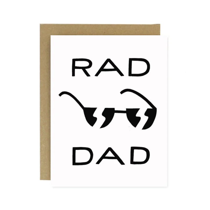 The Rad Dad Father's Day Card by Worthwhile Paper features "RAD DAD" with sunglasses, comes with a brown envelope, and is printed on recycled paper—an eco-friendly choice for Father's Day.