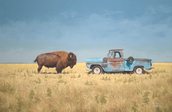A large bison faces an old, rusty blue pickup truck in a grassy field under a clear sky—captured in "Relics" by Matt Tumlinson.