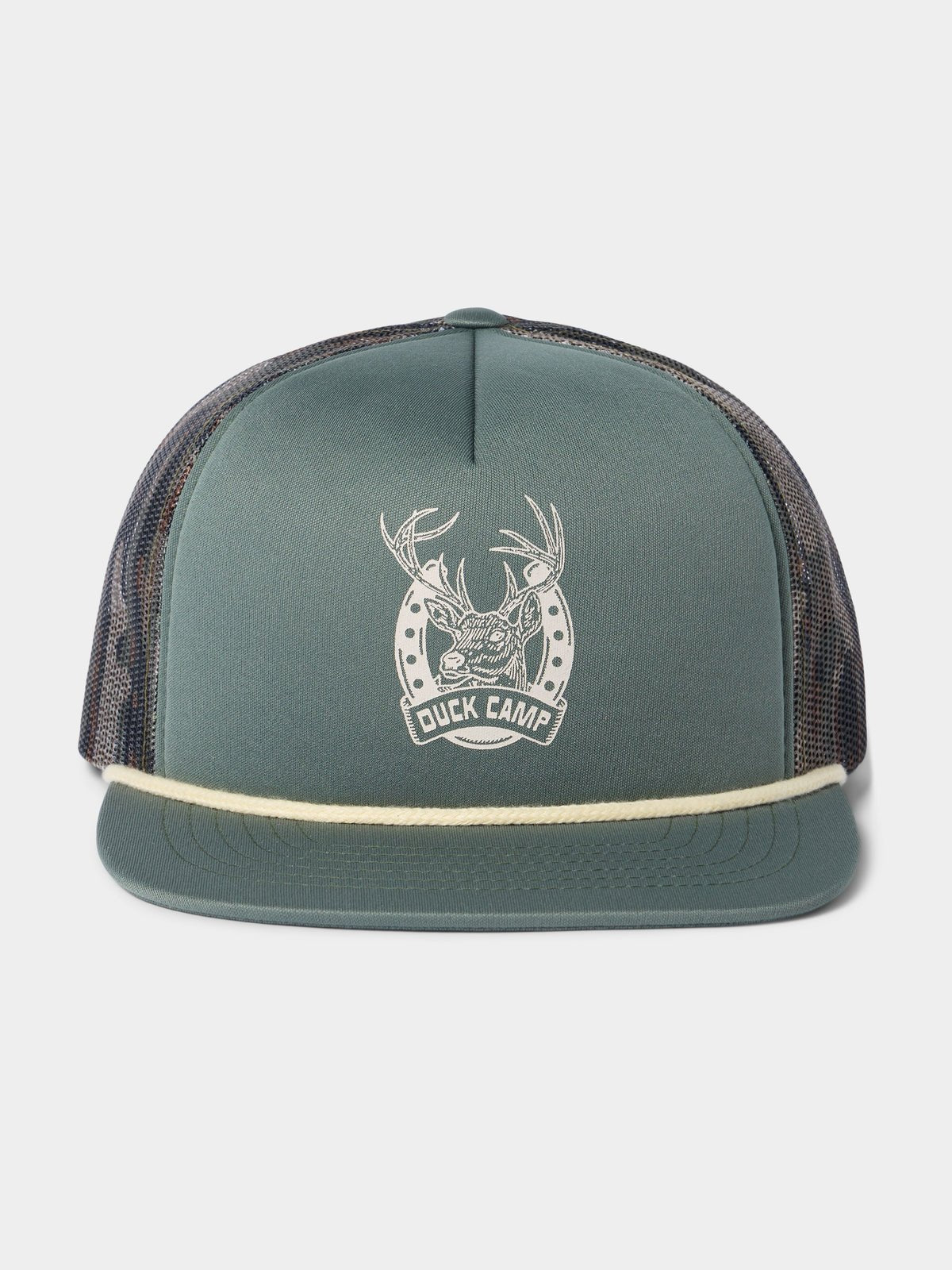 The Duck Camp Lucky Deer Hat is a green trucker hat with mesh back, rope brim detail, and a white front logo with antlers and horseshoe. It features an adjustable snapback for comfort.