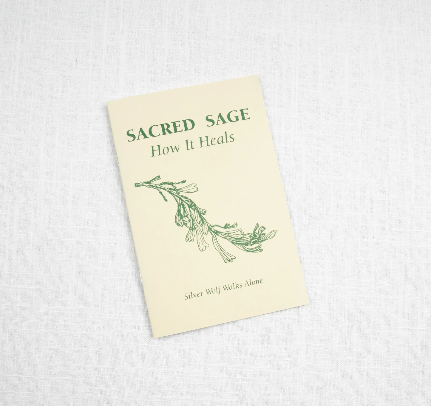 Sacred Sage | Taos Herb Co. by Taos Herb Co is a cream booklet featuring a green sage illustration and the author Silver Wolf Walks Alone on a white textured cover—an inspiring guide to sage healing and ceremonial traditions.