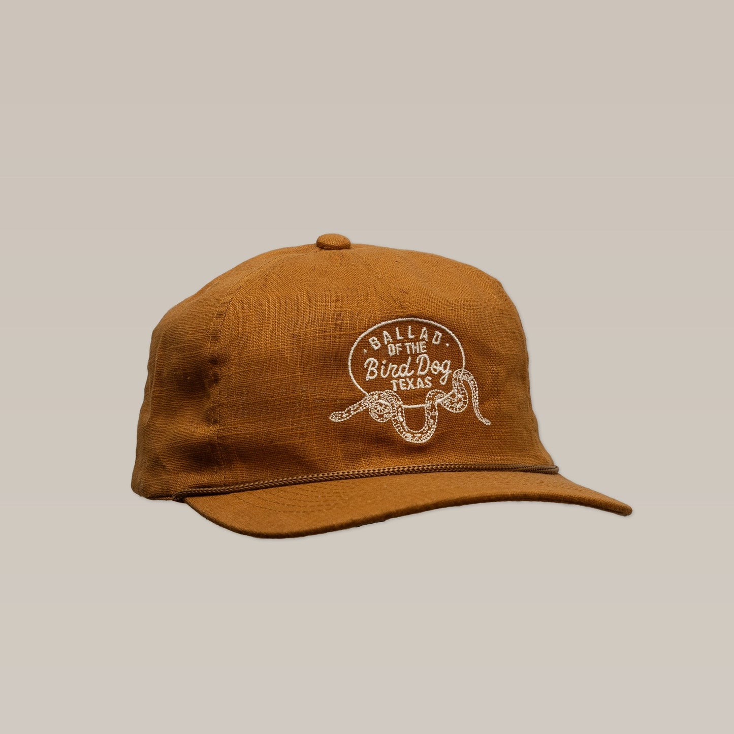 Shop Hat by Ballad of The Bird Dog, featuring a Rattlesnake Oval Logo, handcrafted in Brenham, TX.