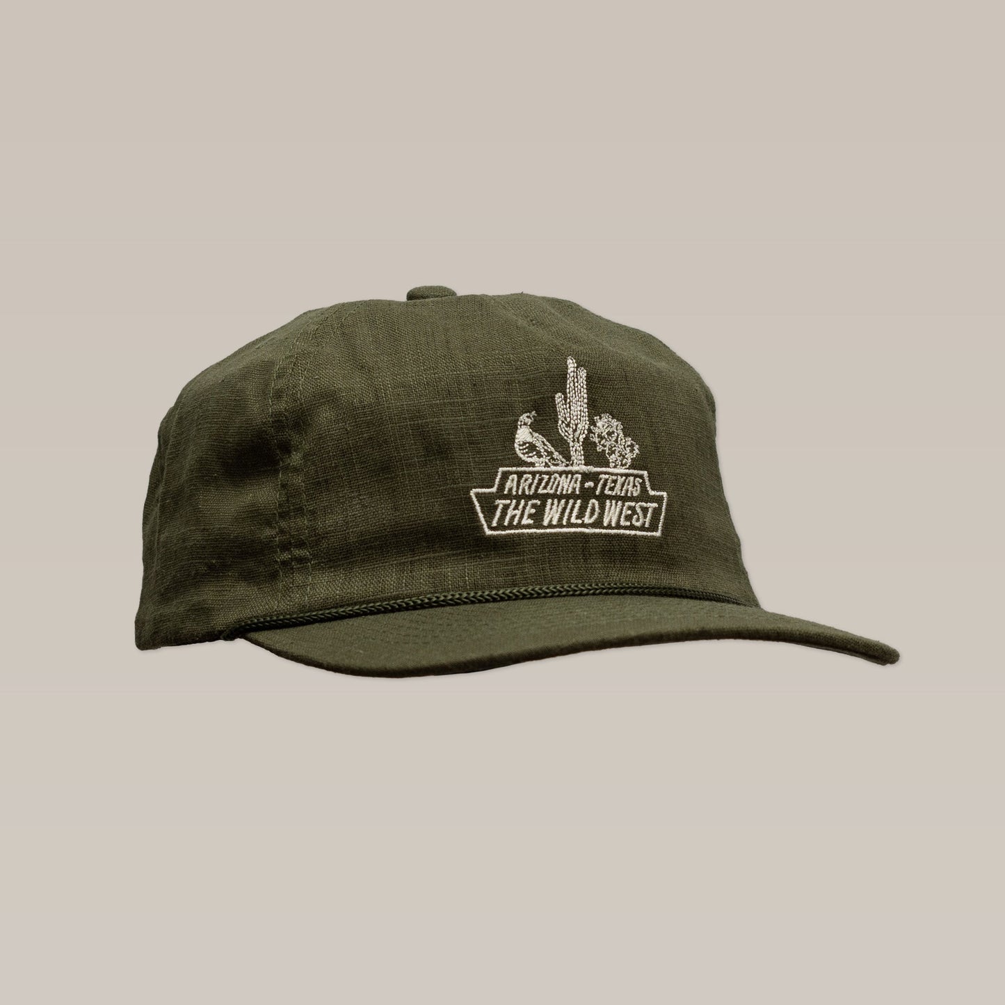 The Ballad of the Bird Dog Shop Hat | The Wild West features an olive green design with embroidered cactus, bird, and "Arizona - Texas The Wild West" on the front—part of our Desert Series Collection.