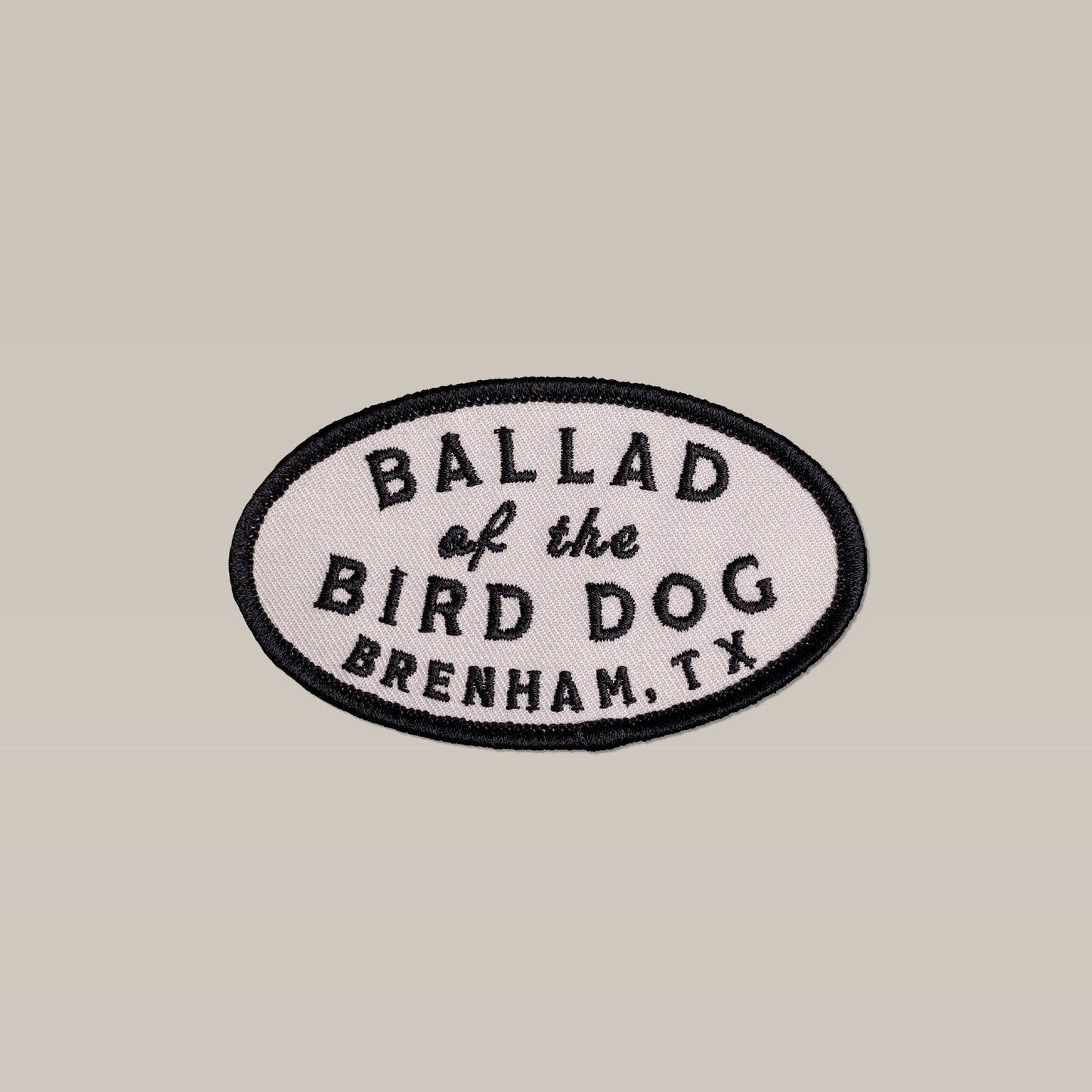 The Shop Patch | Classic Oval by Ballad of the Bird Dog features a light fabric background, black border, and "Ballad of the Bird Dog, Brenham, TX" text.