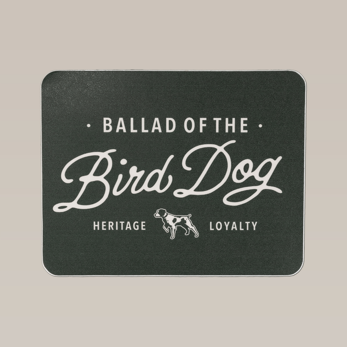 The Shop Sticker | Bird Dog Plate by Ballad of the Bird Dog features a black rectangular design with white "Ballad of the Bird Dog" text, a dog illustration, and "Heritage" and "Loyalty"—ideal for durable outdoor or hunting companion stickers.