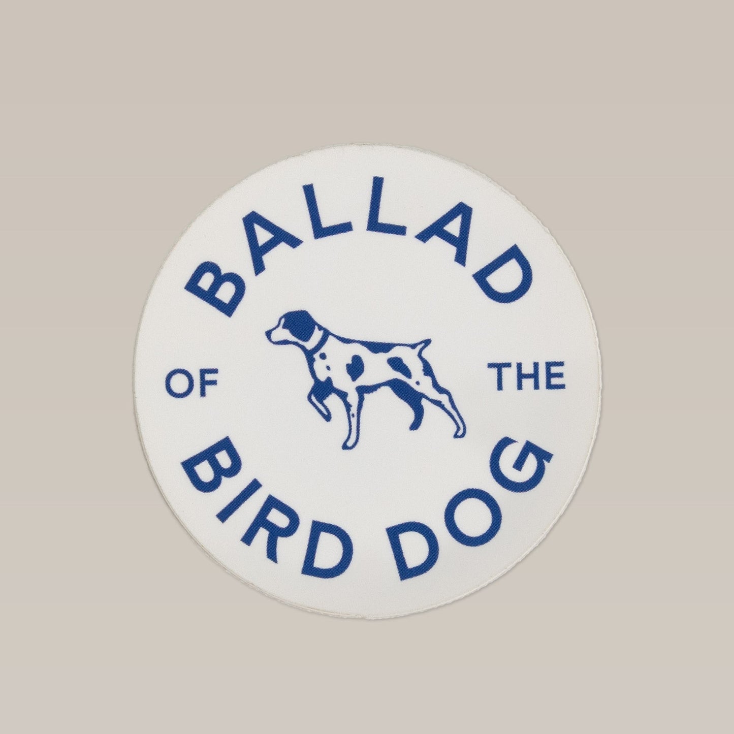 The Ballad of the Bird Dog Shop Sticker features blue text and a spotted dog illustration, inspired by Brenham, Texas' circle clubhouse tradition. From the Ballad of the Bird Dog brand.