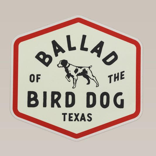 The Shop Sticker | Field Companion by Ballad of the Bird Dog features a hexagonal design with a pointing dog illustration and "Ballad of the Bird Dog Texas" text—ideal for showing brand loyalty or adding a unique flair to your gear.