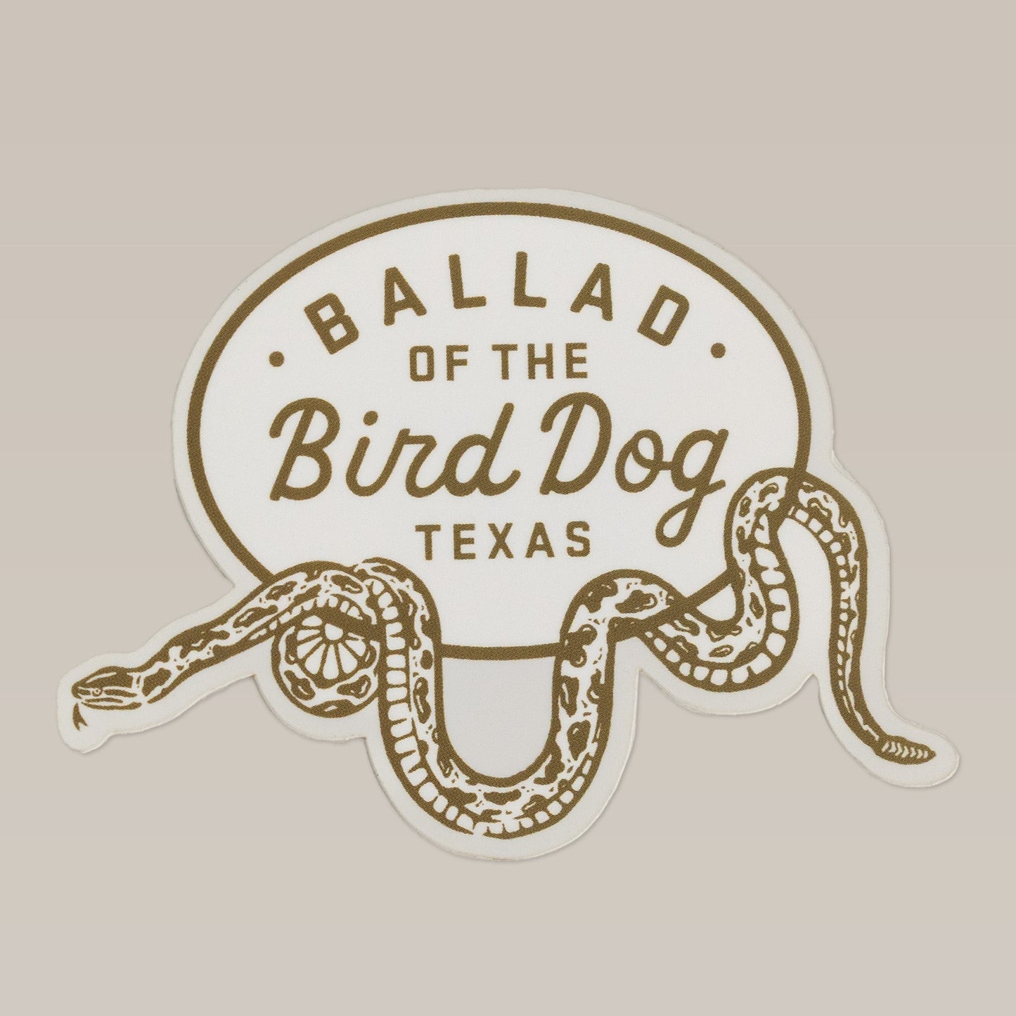 The Ballad of the Bird Dog Shop Sticker | Rattlesnake Oval Wrap features a rattlesnake design from their Desert Series.
