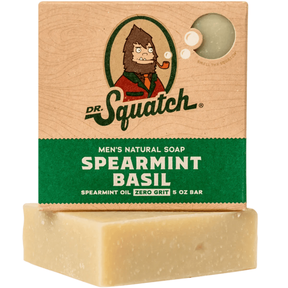 A box of Dr.Squatch Spearmint Basil Soap sits atop an unwrapped minted bar, featuring green and brown packaging with a cartoon mascot to invigorate your senses.