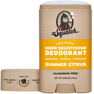 A stick of Dr.Squatch Summer Citrus Deodorant features yellow and wood grain packaging with visible product details and branding.