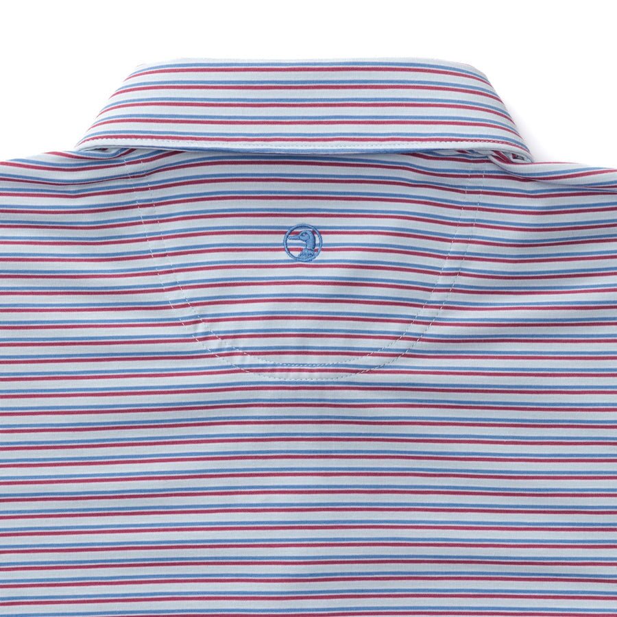 Close-up of the back of the Duck Head Summerford Performance Jersey Polo, featuring horizontal blue, red, and white stripes and a small circular embroidered logo below the collar. Moisture-wicking fabric keeps you comfortable all day.