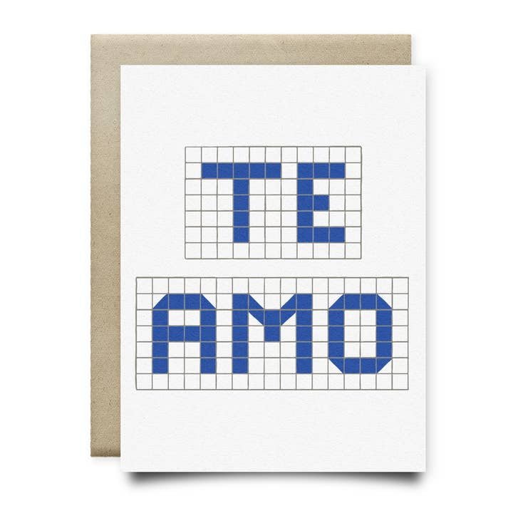 The Te Amo | Houston Blue Tile Greeting Card by Anvil Cards features "TE AMO" in bold blue on a white A2 card with a grid pattern, resting atop a brown envelope, all crafted from sustainable linen paper.