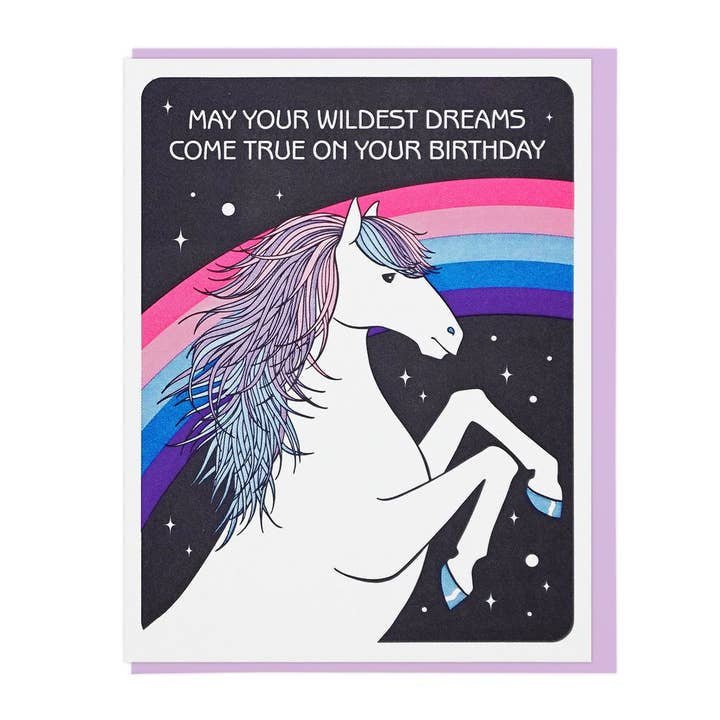 The "Wildest Dreams" greeting card by Lucky Horse Press features a white unicorn, rainbow, stars, and the message "May your wildest dreams come true on your birthday." Made in the USA with a recycled cover.