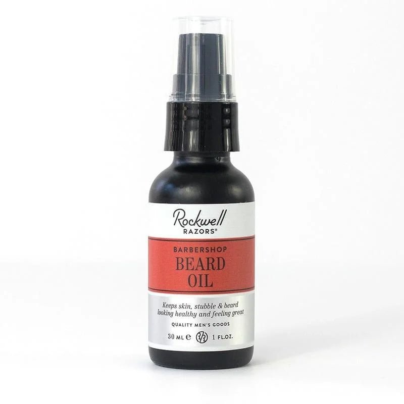 A 30 mL bottle of Rockwell Razors Beard Oil with spray cap, designed to keep beards healthy and provide an authentic barbershop experience.