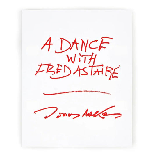 A white page with "A Dance with Fred Astaire" and an unreadable signature, handwritten in red marker, evokes the spirit of Jonas Mekas’s visual autobiography. Book by Anthology Editions.