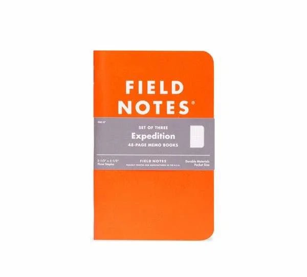 The Field Notes Expedition memo book features an orange cover with a gray band, "48-page memo books," and "Durable Materials, Pocket Size" text—made from water- and tearproof Yupo Synthetic paper.