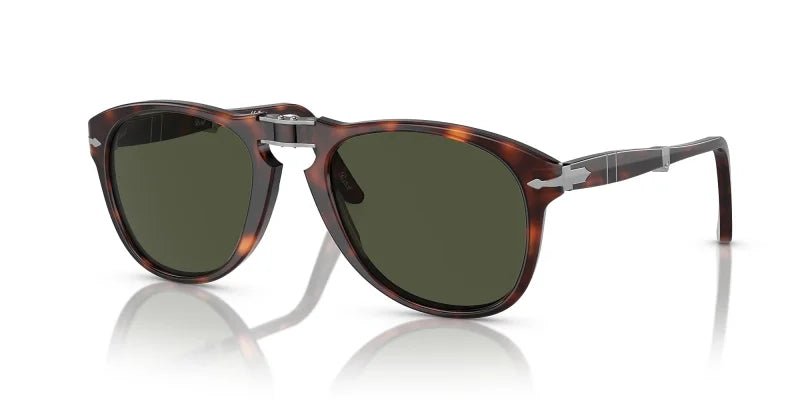 Persol Folding Havana w/ Green (0PO0714) sunglasses feature a tortoiseshell frame, dark green lenses, silver bridge detail, and metal temple accents, inspired by the original Persol 714 and shown on a white background.