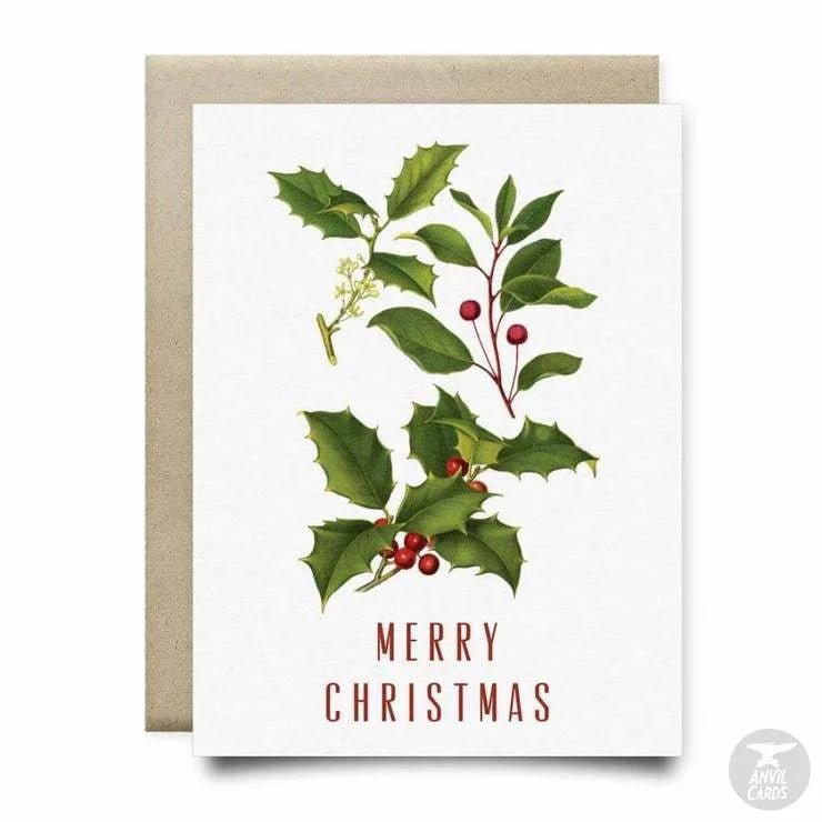 The Holly Merry Christmas Card by Anvil Cards is an A2 linen paper card with holly leaves, berries, and "Merry Christmas" in red on the front. The card is blank inside for your personalized message.