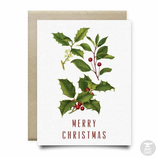 The Holly Merry Christmas Card by Anvil Cards is an A2 linen paper card with holly leaves, berries, and "Merry Christmas" in red on the front. The card is blank inside for your personalized message.
